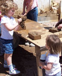 Kids making adobe